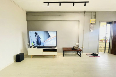 Common room with wall mount aircon and stand fan