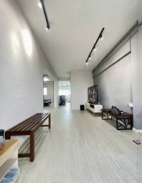 Common room with wall mount aircon and stand fan